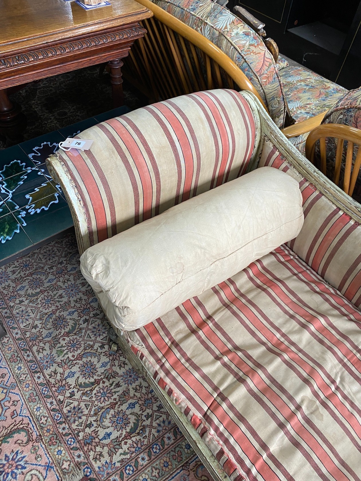 A Regency painted parcel gilt scroll end chaise longue, length 196cm, width 65cm, height 70cm